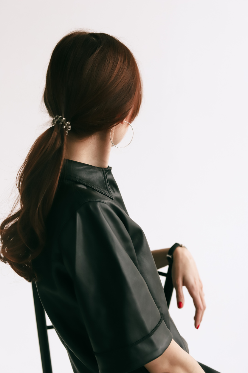 Back View of Woman in Leather Dress